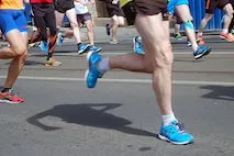 closeup of men's legs while running